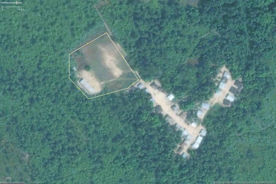 A typical rural school in West Africa. This zoomed in view shows the key features: 1 or 2 long buildings, 1 or 2 smaller toilet buildings, a large bare field. The overall school property should be tagged with amenity=school and the buildings with building=yes.