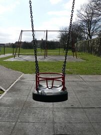 playground=swing baby=yes or playground=baby_swing Standard baby swing - bars are to stop baby escaping, not to provide postural support