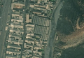 5/7 Marché public (amenity=marketplace) avec de nombreux étals, entouré d'un mur d'enceinte (imagerie satellite Maxar).