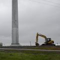 The base of a large tubular steel power pole for a 230 kV / 60 Hz power line under construction.