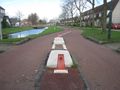 Sump buster su una pista ciclabile (Schonenburgseind, Houten, The Netherlands).