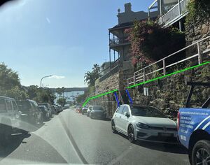 Photo of a road with a sidewalk running along side with significant vertical separation.