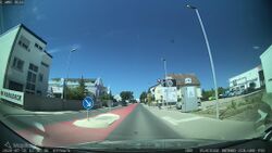 Germany: lanes=3 lanes:forward=1 lanes:backward=1 lanes:both_ways=1 turn:lanes:both_ways=left colour:both_ways=red